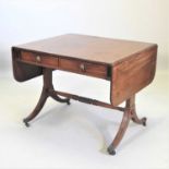 A Regency mahogany and ebony strung sofa table