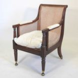 A Regency mahogany single cane bergere library armchair