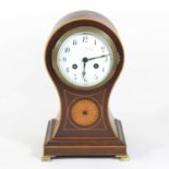 An Edwardian mahogany cased balloon shaped mantel clock