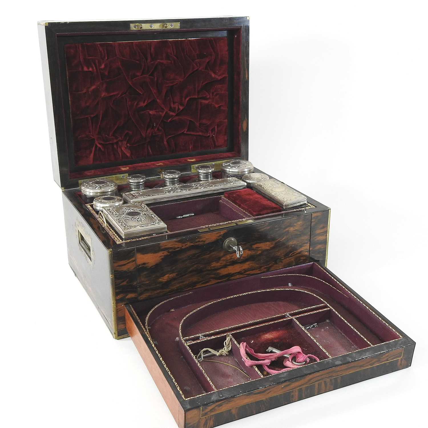 A Victorian coromandel and brass bound dressing case
