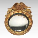 A Regency carved pine and gilt gesso framed convex wall mirror