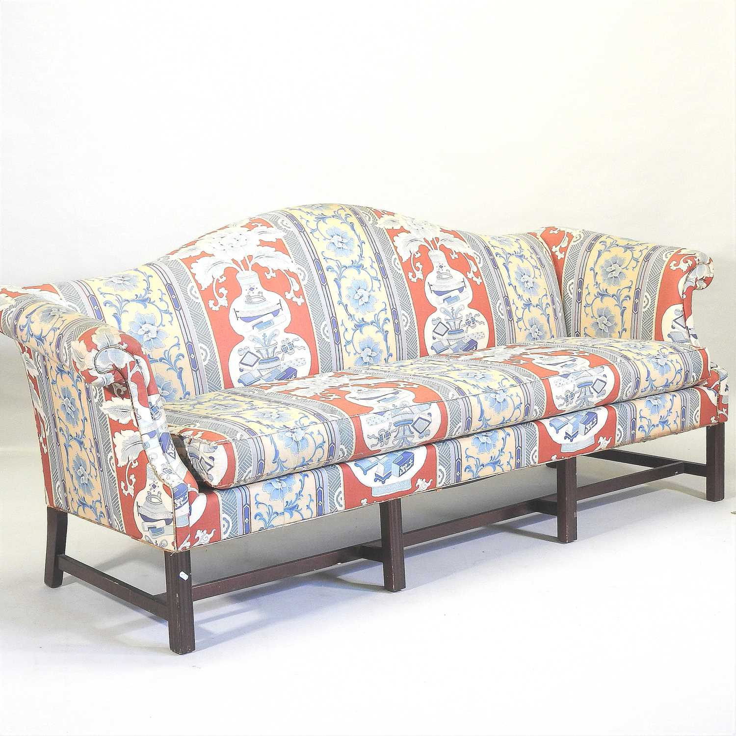 A George III style floral upholstered hump back sofa