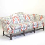 A George III style floral upholstered hump back sofa