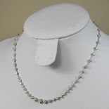 An 18 carat white gold diamond line necklace