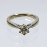 An 18 carat white gold solitaire diamond ring