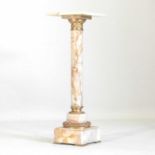 A marble and brass mounted jardiniere stand