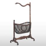 An unusual early 19th century carved mahogany child's cradle