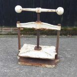 A white painted cast iron press