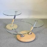 A metamorphic glass top coffee table