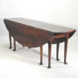 A George III style oak wakes table