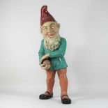 An early 20th century continental painted plaster garden gnome