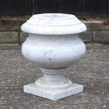 A white marble garden urn