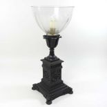 A 19th century patinated bronze candle lamp