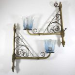 A pair of Arts and Crafts brass wall lights
