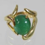 A large 18 carat gold cabochon emerald ring