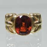 A 14 carat gold hessonite garnet ring
