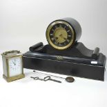 A Victorian black slate mantel clock