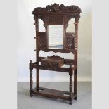A Victorian heavily carved oak hallstand