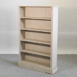 A grey painted open bookcase