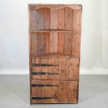 A rustic pine standing corner cupboard