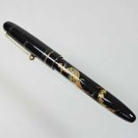 A Namiki gilt and black lacquered fountain pen