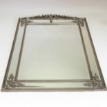 A large silver painted framed wall mirror