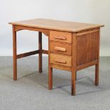 A mid 20th century light oak desk