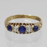 An 18 carat gold five stone sapphire and diamond ring