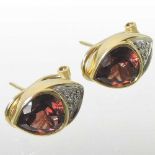 A pair of 18 carat gold diamond and gem set earrings