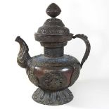 A large Tibetan copper teapot and cover