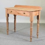 An antique pine side table