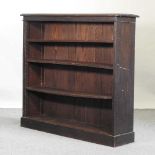 An early 20th century dwarf open bookcase
