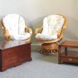 A pair of bamboo revolving armchairs