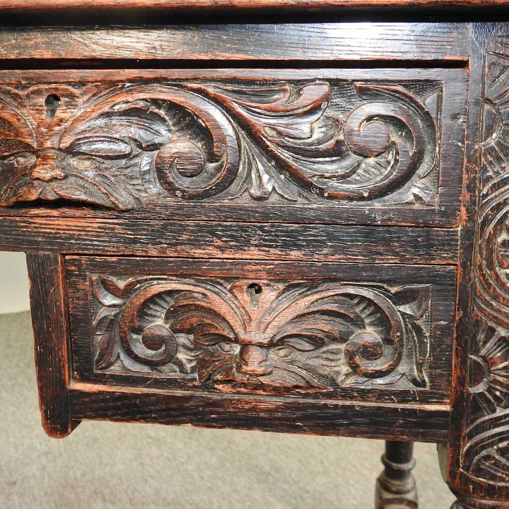 A 19th century carved oak kneehole desk - Image 2 of 8