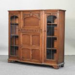 A mid 20th century carved oak secretaire bookcase