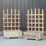A pair of garden planters, with trellis