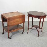 An Edwardian mahogany two tier occasional table