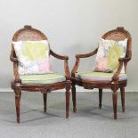 A pair of early 20th century Louis XVI style armchairs