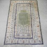 A Persian woollen prayer rug