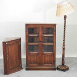 A reproduction glazed oak bookcase