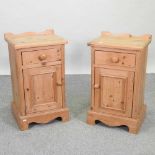 A pair of modern pine bedside cupboards