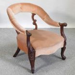 A Victorian carved rosewood armchair
