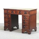 A reproduction pedestal desk