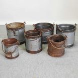 A set of three vintage style metal milk buckets,