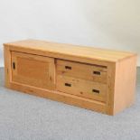 A modern light oak side cabinet