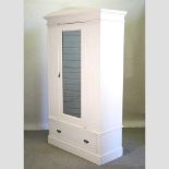 An early 20th century and later painted single wardrobe