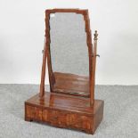 An Art Deco oak swing frame toiletry mirror