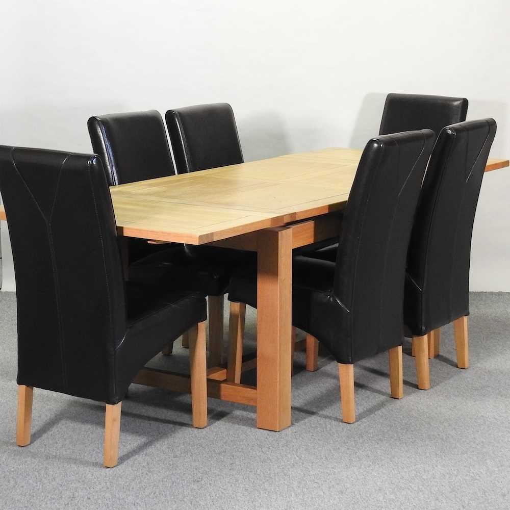 A modern oak draw leaf extending table