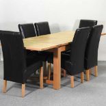 A modern oak draw leaf extending table