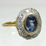 An 18 carat gold sapphire and diamond cluster ring
